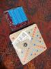 Scrabble Board Game with Maroon Letter Tiles and Blue Racks - 2