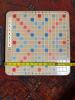 Scrabble Board Game with Maroon Letter Tiles and Blue Racks - 3
