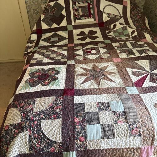 Handmade Patchwork Quilt with Floral and Geometric Design