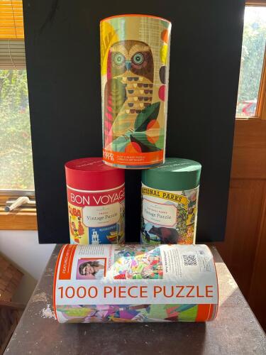 Four Assorted 1000 Piece Puzzles