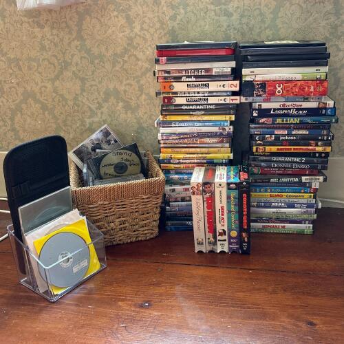 Assorted DVDs, VHS Tapes, and Music CDs Multimedia Collection