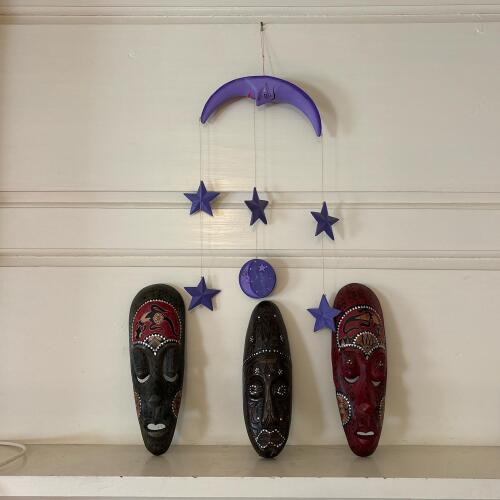 Painted Wooden Celestial Mobile and Three Tribal-Style Wooden Masks