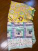 Two Handmade Quilts in Patchwork and Floral Patterns