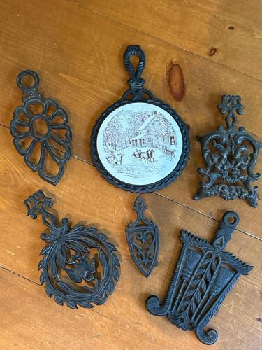 Six Cast Iron Trivets with Decorative Patterns