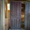 Old Wooden Four-Panel Door with Iron Hardware
