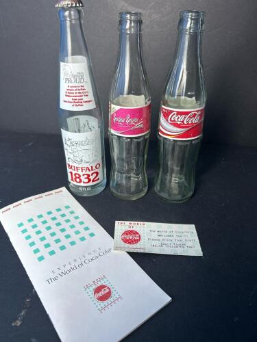 Coca-Cola Commemorative and International Glass Bottles with World of Coca-Cola Ephemera