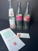 Coca-Cola Commemorative and International Glass Bottles with World of Coca-Cola Ephemera