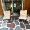 Two Lyon-Shaw Wrought Iron Patio Chairs and Glass-Top Side Table