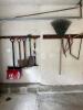 Assorted Hand Tools: Shovels, Rake, Saws, Snow Shovel, Hammer