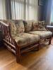 Rattan Loveseat With Floral Upholstered Cushions