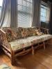 Rattan Sofa With Floral Upholstered Cushions