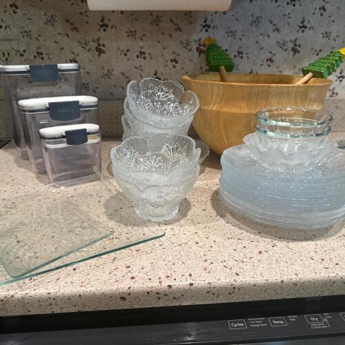Assorted Glass Bowls, Plates, Canisters, and Wooden Salad Bowl