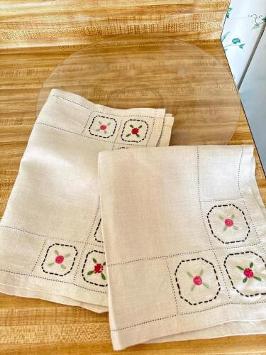 Embroidered Linens With Floral Motif and Glass Platter