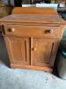 Country-Style Wooden Cabinet with Drawer and Paneled Doors