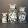 Trio of Glass Apothecary Jars with Floral Motifs