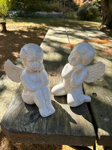 Pair of White Glazed Ceramic Cherub Figurines