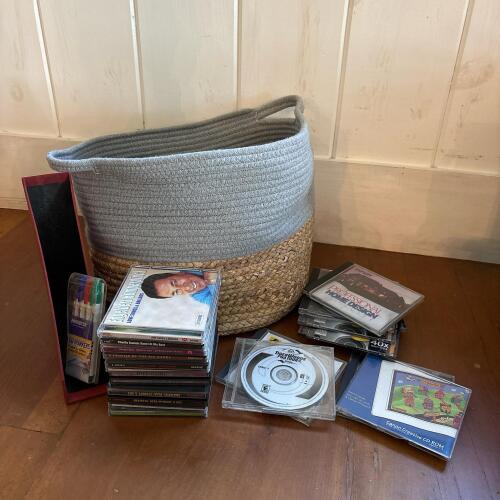 Assorted CDs and CD-ROMs with Woven Storage Basket
