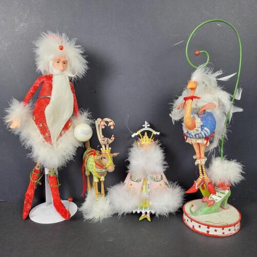 Whimsical Christmas Figurines With Feather Trim And Festive Attire