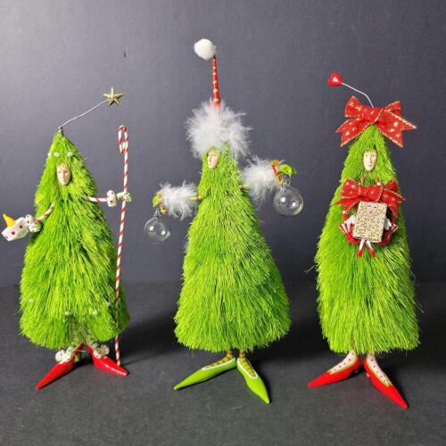 Whimsical Christmas Tree Figurines in Festive Attire