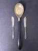 Serving Spoon with Black Handle and Pair of Silverplate Butter Knives