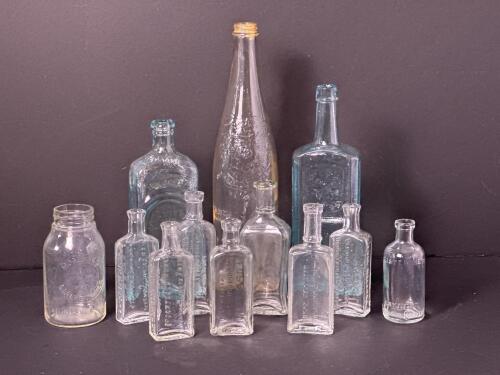 Antique and Vintage Embossed Glass Bottles and Jar Assortment