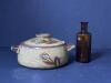 Stoneware Pot With Lid, Floral Motif and Embossed Scotch Oil Bottle