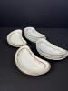 Twelve Crescent Bone Dishes with Scalloped Edges