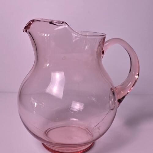 Pink Glass Pitcher With Rounded Body and Handle