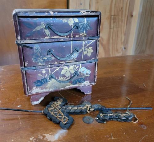 Vintage Japanese Lacquered Jewelry Chest with Coin Sword Decoration