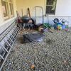 Grouping of Outdoor Garden Tools, Ladders, Pots, and Wheelbarrow